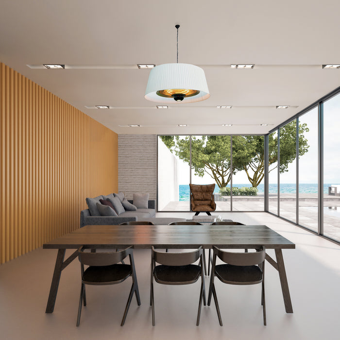 A Paragon Sol Pendant Electric Heater suspended over an outdoor dining table, blending seamlessly with the modern decor while providing warmth