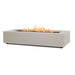 Light sand Real Flame Aegean 70" rectangle gas fire pit table with lava rock bed and dancing flames shown at angle on white background
