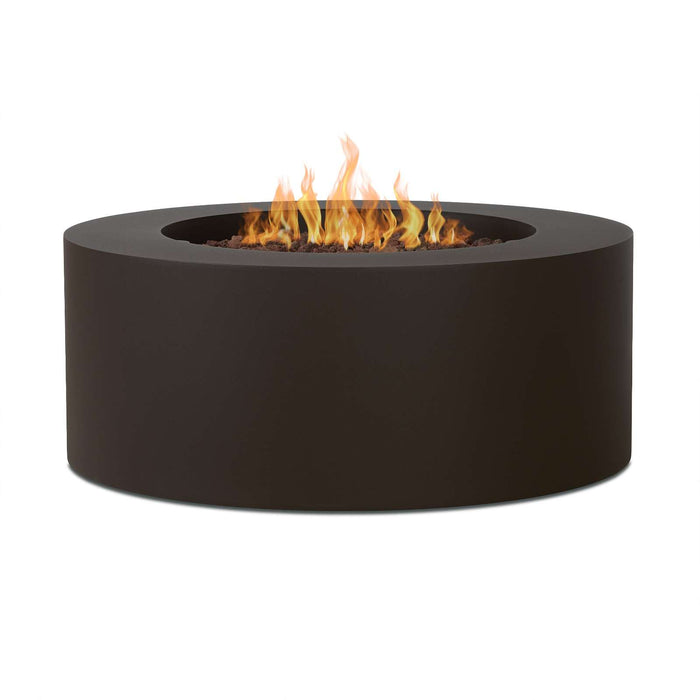 Dark bronze Real Flame Aegean round gas fire pit table with cylindrical base, lava rock bed and dancing flames on white background