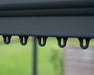 Close up detail of Palermo gazebo curtain and mosquito netting hanger hooks on grey aluminum frame rail system designed for easy attachment of gazebo accessories.