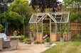 Rear perspective of the Alton Cedar Structure Durham Greenhouse 7x12, highlighting the structure’s spacious design and detailed craftsmanship.