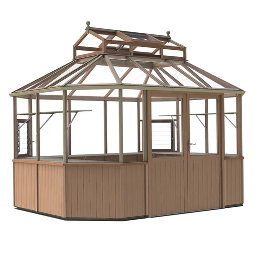 The Evolution Octagonal 9x11 by Alton Cedar Structure is a wooden-framed glass greenhouse with a brown base. It features multiple windows and a door, all under a sloped roof complete with two smaller vent structures on top.