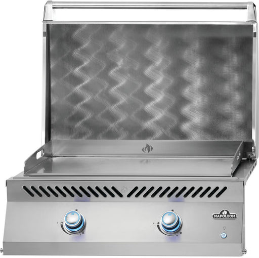 Left angle view of Napoleon Built-In 700 Series 32" Griddle with lid open and lit control knobs