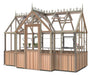 Angled view of the Alton Cedar 7x12 Durham greenhouse showcasing its elegant design with wooden panels and glass structure.