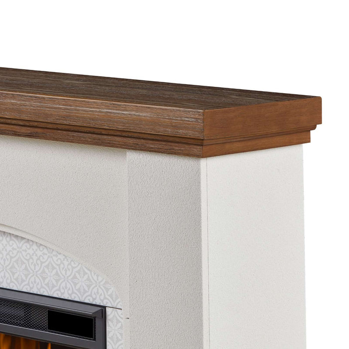 Close-up detail of Real Flame Anika electric fireplace showing rich pine wood mantel top grain texture and white faux stucco body with decorative tile surround arch below