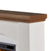 Close-up detail of Real Flame Anika electric fireplace showing rich pine wood mantel top grain texture and white faux stucco body with decorative tile surround arch below
