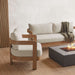 Cozy lounge view of the Real Flame Arlo Outdoor Seat Sofa next to a fire pit table and a matching sofa, styled in a textured indoor-outdoor setting.