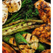 Charred vegetables and succulent pieces of chicken grilled to perfection on the Arteflame Black Label One Series 20" Grill, showcasing the even cooking surface.