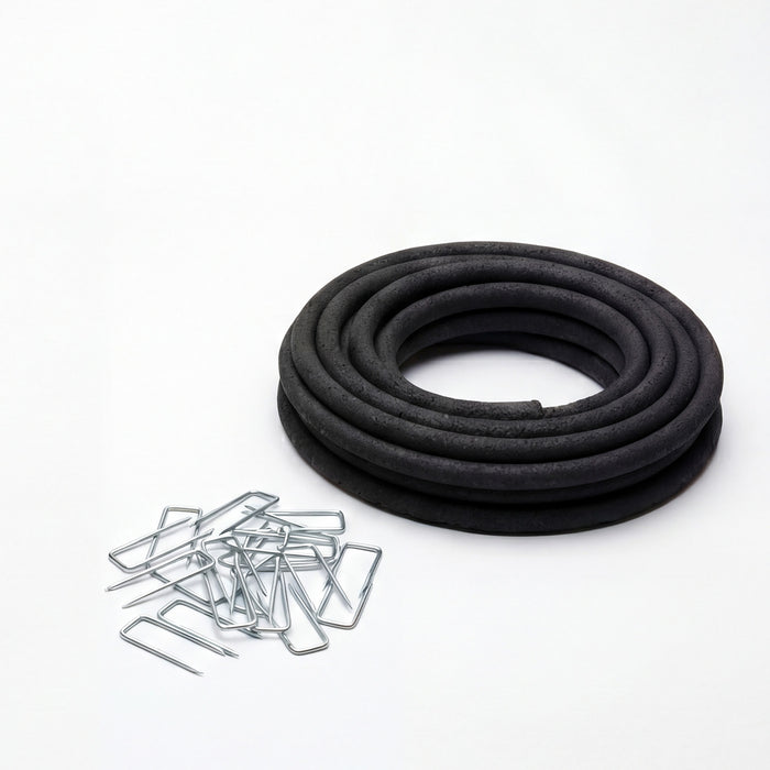 Coiled black porous soaker hose and galvanized ground staples included in the Auto-Watering System by Outdoor Living Today