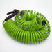Green coiled garden hose with a multi-pattern spray nozzle from the Outdoor Living Today Auto-Watering System, shown on a white background