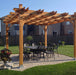 Outdoor Living Today Pergola with Retractable Canopy 12x12 with an outdoor dining set underneath in a fenced backyard