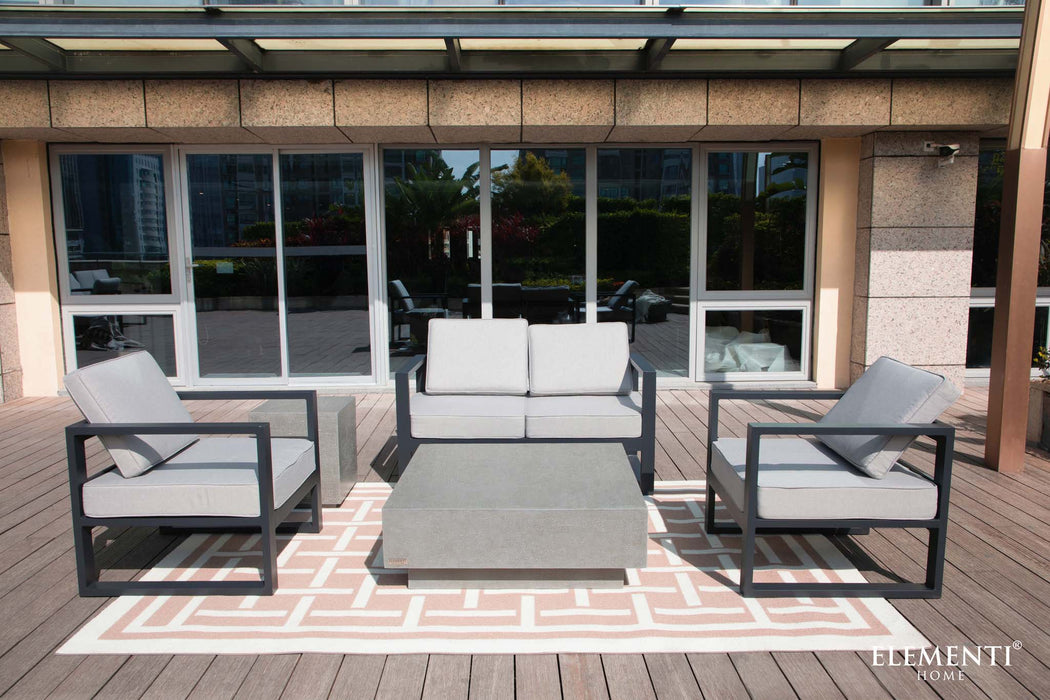 Stylish balcony setup with sleek seating and the Elementi Tevere Series Square Coffee Table in Space Grey as the focal point.