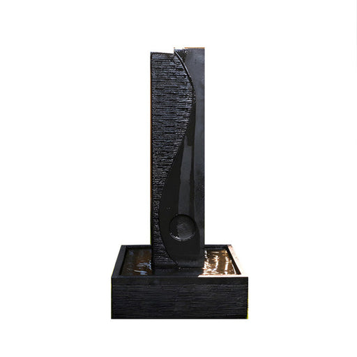 Black finish Yang modern water fountain isolated on white background with textured column design and square basin base.