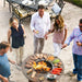 Social gathering around the Arteflame Black Label Euro Grill, with guests enjoying the grill's ambiance and cooking functionality.