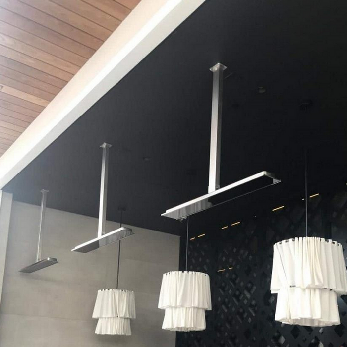 Bromic Heating Platinum Electric Heater suspension kits installed on ceiling, providing secure mounting for outdoor heating units in a modern covered area.
