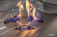 Close-up of the flame and stainless steel burner on the Elementi Perth Ethanol Fire Table in slate black