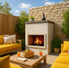 Cabo patio series fireplace installed in outdoor lounge area with fire burning in brick-lined firebox.