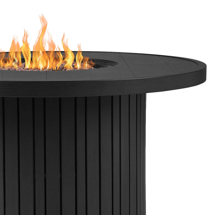 Close-up detail of the Real Flame Calvin fire pit table showing tall open flames over lava rocks with the black fluted aluminum base and tabletop edge visible