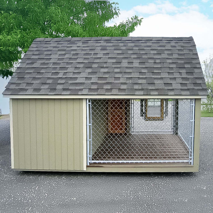Rear exterior of the Cape Cod Cozy Kennel showing the full-length chain-link enclosure and wooden siding with gable roof.