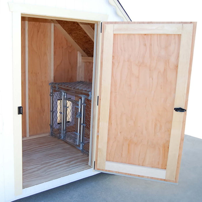 Inside look at the Cape Cod Cozy Kennel by Little Cottage Co. featuring natural wood walls and metal kennel section.