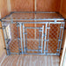 Interior of Cape Cod Cozy Kennel showing secure metal fencing and wooden walls inside the kennel structure.