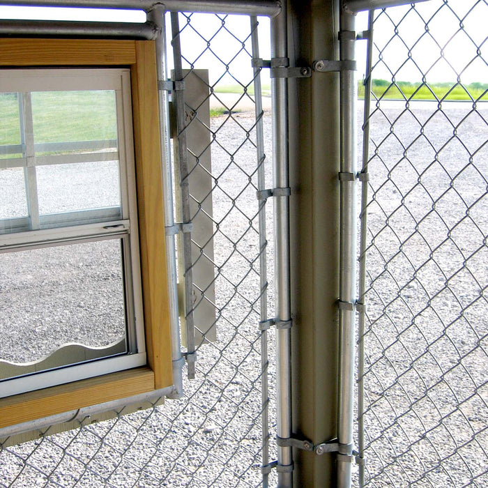 Close-up of Little Cottage Co. Cape Cod Cozy Kennel showing interior window frame and sturdy chain-link panel detail.