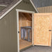 Wooden door of Little Cottage Co. Cape Cod Cozy Kennel open, revealing interior kennel space with chain-link enclosure.
