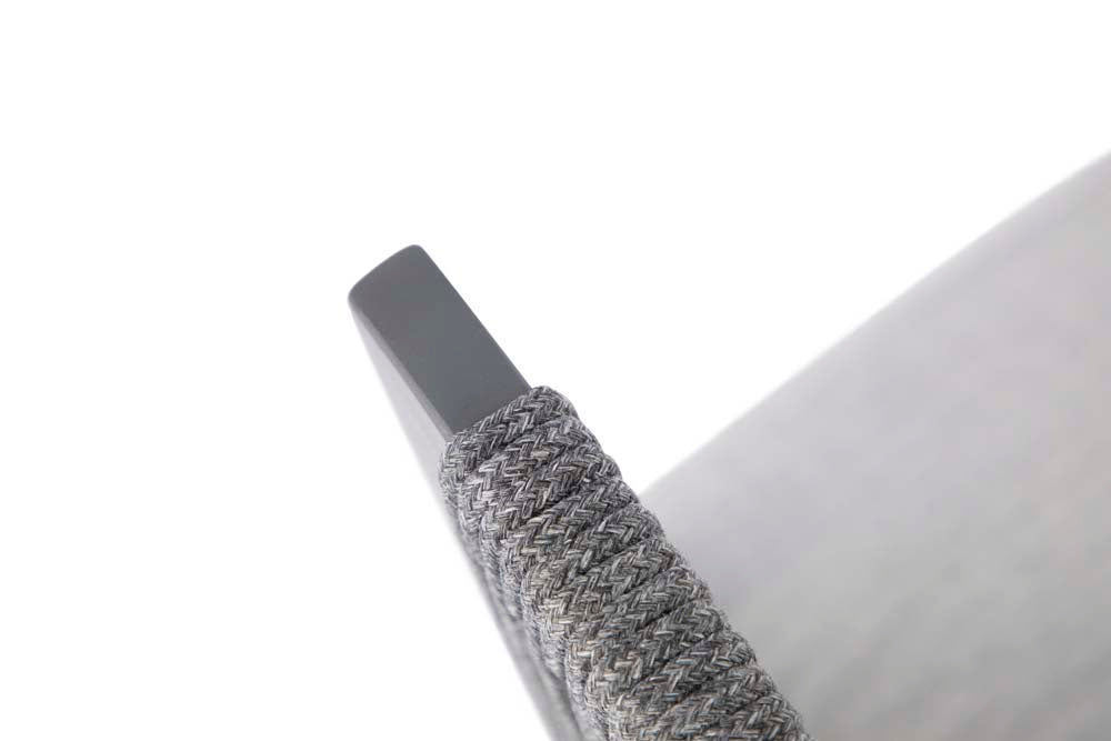 Detailed top view of the Capri Collection outdoor chair armrest by Elementi, highlighting the refined texture of the woven gray rope wrapping.