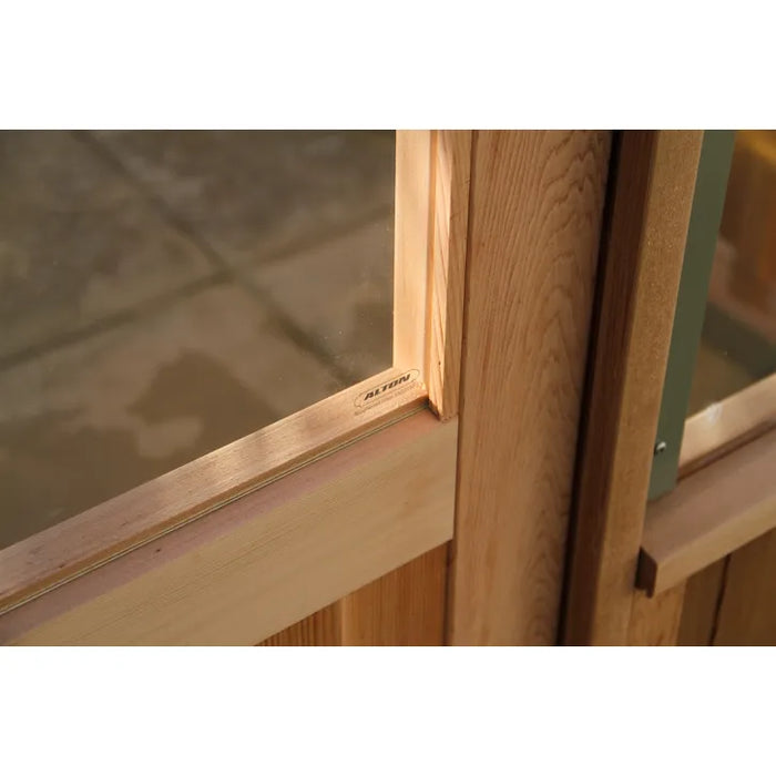 Close-up of the cedar door detail featuring Alton branding on the Alton Lancing Greenhouse.