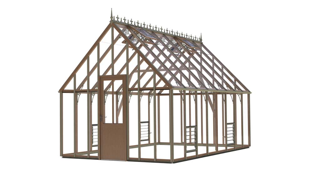 A 10x16 foot Alton Cedar Structure Lancing greenhouse. This wooden greenhouse features a pitched roof with ornate cresting. It includes a central door, several smaller windows along the sides, and a dark wood frame with clear glass panes.