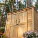 Close-up detail of the Grand Garden Chalet 6x3 shed's cedar siding, showing natural wood grain and panel texture.