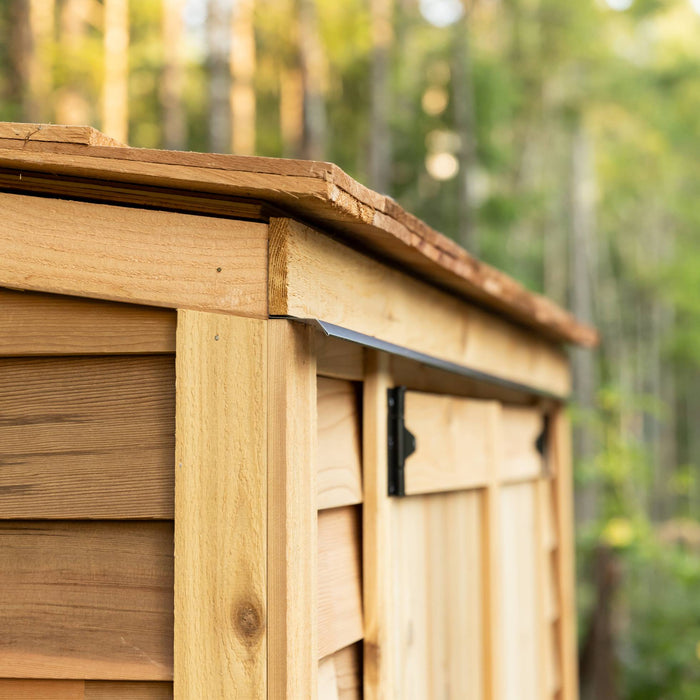 Close-up of cedar siding detail on the Grand Garden Chalet 6x3, highlighting natural wood grain and quality craftsmanship.