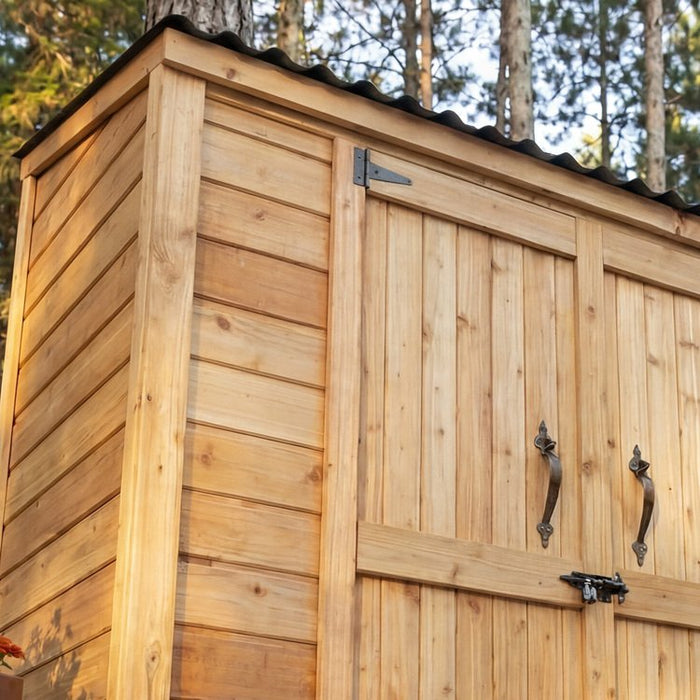 Side angle view of the Grand Garden Chalet 6x3 cedar garden shed with double doors and peaked roof.