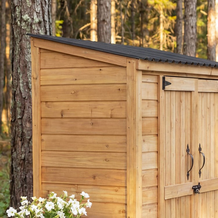 Cedar garden chalet shed shown from a side angle, highlighting the natural wood siding and peaked roof design.