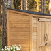 Cedar garden chalet shed shown from a side angle, highlighting the natural wood siding and peaked roof design.