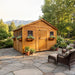 Side angle view of the 12x12 cedar Sunshed garden shed, showing detailed wood paneling and roof construction.