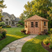 Cedar garden shed 9x9 Penthouse style shown from a side angle, highlighting its sloped roof and wooden panel doors.