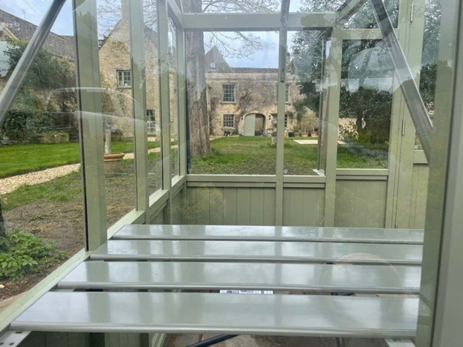 The Alton Cedar Structure Durham Greenhouse with its roof vent open, emphasizing ventilation and practical design.