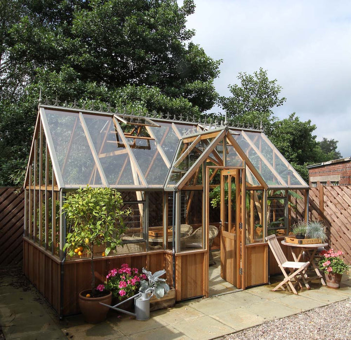 Cambridge Greenhouse by Alton Cedar Structure with natural light streaming through the glass panels.