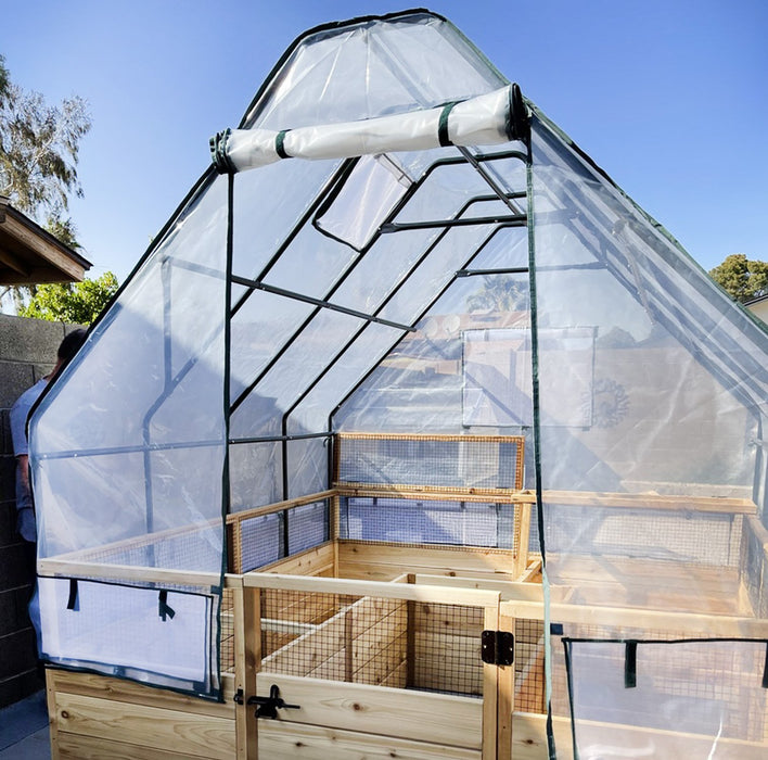 An Outdoor Living Today Garden in a box with Greenhouse, with a wooden frame and netting.