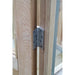 A robust metal hinge fitted to the cedar-framed door of the Alton Lancing Greenhouse.