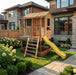 Outdoor Living Today Little Cedar Playhouse with yellow wave slide beside a modern stone and wood home