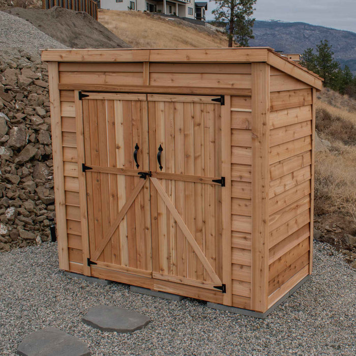 Cedar SpaceSaver 8x4 storage shed shown from the side, featuring double doors on the front facade.