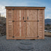 Close-up of the cedar SpaceSaver 8x4 shed's double door detail, showing natural wood grain and sturdy hardware.