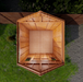 Side view of the 12x12 cedar Space Master storage shed showing its double door entrance and peaked roofline.