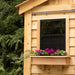 Cedar storage shed 12x16 with double door detail view, showcasing the wood grain and sturdy latch hardware.