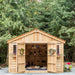 Side angle view of the 12x16 cedar Space Master storage shed showing its double door entrance and wood siding.