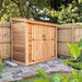 Side view of the 8x4 cedar SpaceSaver storage shed showing its double door entrance and sloped roof design.