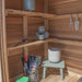 Closeup of the cedar storage shed's double door detail on the SpaceMaster 6x4, showing wood grain and hardware.