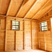 Close-up of the cedar storage shed's double door detail, showing natural wood grain and sturdy hardware.